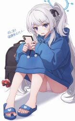 1girl black_bag blue_archive blue_hoodie blush grey_hair halo highres holding holding_phone hood hoodie knees_up looking_at_viewer miyako_(blue_archive) miyako_(young)_(blue_archive) no_pants one_side_up oversized_clothes panties panties_peek pantyshot phone purple_eyes ripnte simple_background sitting slippers solo spread_toes toes underwear white_background white_panties