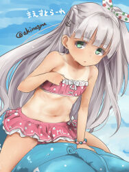 1girl akino_shuu anchor_hair_ornament artist_name bikini bikini_skirt bow character_name commentary_request flat_chest green_eyes grey_hair hair_bow hair_ornament inflatable_toy kantai_collection long_hair looking_at_viewer maestrale_(kancolle) multicolored_polka_dots one-piece_tan one_side_up open_mouth pink_bikini polka_dot polka_dot_bikini polka_dot_bow solo swimsuit tan tanline twitter_username