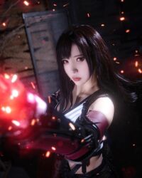 1girl bare_shoulders black_hair black_skirt blurry blurry_background breasts cosplay cosplay_photo earrings female_focus final_fantasy final_fantasy_vii final_fantasy_vii_remake gauntlets gloves highres ja10888 jewelry korean_(nationality) large_breasts long_hair looking_at_viewer photo_(medium) real_life red_eyes skirt solo square_enix tank_top tifa_lockhart tifa_lockhart_(cosplay) white_tank_top