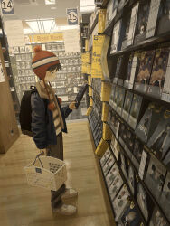 1boy absurdres backpack bag basket beanie brown_hair brown_pants closed_mouth commentary_request dvd_case earflap_beanie from_side fur-trimmed_jacket fur_trim grey_jacket hat highres holding holding_basket indoors jacket long_sleeves male_focus open_clothes open_jacket original pants pom_pom_(clothes) pom_pom_beanie red_hat sasakure_(mogunonbi) shelf shirt shoes shop shopping_basket short_hair sneakers solo standing striped_clothes striped_shirt white_shoes