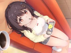 1girl 1other ankle_socks black_hair bow_camisole breasts brown_eyes camisole cardigan cellphone coffee coffee_mug cohiyuri collarbone commentary_request couch cup dolphin_shorts dutch_angle film_grain food food_in_mouth from_above grey_shorts hair_between_eyes hair_ornament hairclip hibi_wa_sugiredo_meshi_umashi holding holding_phone hood hooded_cardigan indoors kawai_mako knees_up light_blush long_bangs long_hair looking_at_viewer looking_up lying medium_breasts mug no_shoes on_back on_couch open_cardigan open_clothes phone pillow pocky pocky_in_mouth pov short_shorts shorts smartphone socks steaming_cup white_camisole white_socks yellow_cardigan
