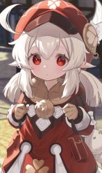 1girl :o backpack bag blurry blurry_background brown_gloves child clenched_hands cowboy_shot day feathers fur genshin_impact gloves hair_between_eyes hands_up hat highres klee_(genshin_impact) light_brown_hair looking_at_viewer namaonpa outdoors parted_lips pointy_ears randoseru red_eyes sidelocks solo standing