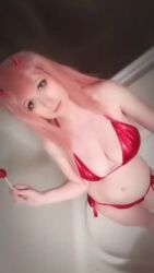 1girl animated bathtub bikini candy cosplay darling_in_the_franxx eyelashes food licking_honey lollipop nonbinary nude pink_hair swimsuit tagme usatame video zero_two