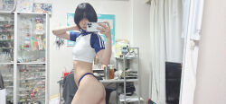 1girl absurdres ass black_hair cellphone from_side highres indoors looking_at_phone mirror_image mirror_selfie phone photo_(medium) real_life room selfie short_hair smartphone ushijima_iiniku