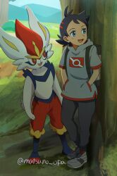 1boy :d against_tree backpack bag black_hair black_pants blue_eyes cinderace commentary_request day gen_8_pokemon goh_(pokemon) grass grey_footwear grey_shirt hands_in_pockets looking_to_the_side male_focus matsuno_opa nintendo open_mouth outdoors pants pokemon pokemon_(anime) pokemon_(creature) pokemon_journeys red_socks shirt shoes short_sleeves smile socks standing tongue tree twitter_username