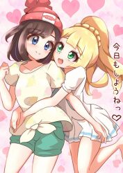 Rule 34 | 2girls, :d, barefoot, black hair, blue eyes, braid, breasts, couple, cowboy shot, front-tie top, green eyes, green shorts, hat, heart, heart background, hug, hug from behind, huge breasts, japanese text, lillie (pokemon), long hair, looking at another, medium hair, multiple girls, nintendo, open mouth, pink background, pokemon, pokemon sm, ponytail, red hat, selene (pokemon), shirt, shorts, skirt, smile, standing, white shirt, white skirt, yuri, yuzukiaz