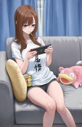 1girl akiyama_akane blue_eyes blush breasts brown_hair closed_mouth couch eating food_in_mouth gen_1_pokemon glasses highres holding indoors large_breasts long_hair nintendo nintendo_switch original pillow pokemon pokemon_(creature) round_eyewear shirt shorts sitting slowpoke smile solo white_shirt yukimaru_ai