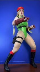 1girl animated ass bare_shoulders blonde_hair boots braid breasts cammy_white cammy_white_(cosplay) cosplay fingerless_gloves gloves hat kicking large_breasts lin_li_cosplay real_life sleeveless standing standing_on_one_leg street_fighter tagme video
