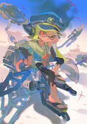 Rule 34 | 1girl, agent 3 (splatoon), behind-the-head headphones, black leggings, black sandals, blue hat, captain 3 (splatoon), closed mouth, flip-flops, full body, green hair, hand on own cheek, hand on own face, hat, headphones, highres, inkling, layered sleeves, leggings, long hair, long sleeves, nintendo, orange eyes, patchwork clothes, peaked cap, sandals, shirt, short over long sleeves, short sleeves, sitting, solo, splatoon (series), splatoon 3, tentacle hair, torn clothes, torn leggings, towo nita, very long hair, white shirt
