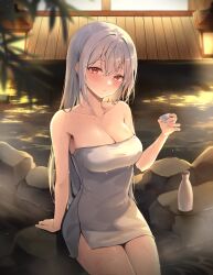 1girl blush breasts choko_(cup) cleavage closed_mouth collarbone commentary_request cowboy_shot cup hair_between_eyes heeri highres holding holding_cup lantern large_breasts long_hair looking_at_viewer naked_towel onsen original red_eyes sitting solo tokkuri towel wet wet_hair white_hair