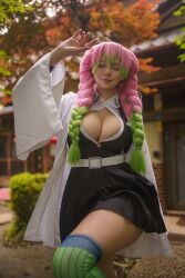 1girl alina_becker breasts brown_eyes cleavage cosplay demon_slayer_uniform female_focus green_eyes green_hair happy highres kanroji_mitsuri kanroji_mitsuri_(cosplay) kimetsu_no_yaiba large_breasts long_hair looking_at_viewer multicolored_hair one_eye_closed photo_(medium) pink_hair skirt smile solo thighs