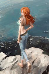 1girl blue_bra blue_pants bra breasts closed_mouth denim from_behind fuyumurasaki highres jeans long_hair nami_(one_piece) ocean one_piece orange_hair outdoors painterly pants rock shoulder_tattoo solo standing tattoo underwear water