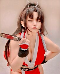 1girl breasts brown_hair cleavage closed_eyes closed_mouth cosplay cosplay_photo fatal_fury female_focus highres large_breasts long_hair photo_(medium) ponytail real_life ririnacos shiranui_mai shiranui_mai_(cosplay) snk solo
