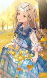1girl apron autumn bib_collar blonde_hair blue_dress colored_eyelashes commentary_request dappled_sunlight dress falling_leaves frilled_apron frilled_sleeves frills gakuen_idolmaster ginkgo_leaf hachimitsu_ame_(phoenix) hair_ornament hairclip highres idolmaster leaf lens_flare light_blush light_particles looking_at_viewer orange_eyes outdoors parted_lips plaid_clothes plaid_dress raised_eyebrows shinosawa_hiro shirt skirt_hold sleeve_ribbon smile solo sunlight three-quarter_sleeves white_shirt