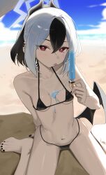 1girl absurdres arm_support bare_arms barefoot beach bikini black_bikini black_hair black_horns black_nails black_wings blue_archive breasts bright_pupils day feet fingernails food hair_between_eyes halo hand_up highres holding holding_food holding_popsicle horns kayoko_(blue_archive) long_fingernails looking_at_viewer melting multicolored_hair popsicle red_eyes single_wing sitting small_breasts solo swimsuit syhan tongue tongue_out two-tone_hair wariza white_hair white_halo white_pupils wings