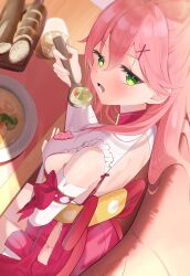 1girl absurdres back back_cutout breasts clothing_cutout detached_sleeves food frilled_kimono frills from_side green_eyes hair_ornament hakama hakama_short_skirt hakama_skirt highres hip_vent holding hololive japanese_clothes kimono large_breasts long_hair long_sleeves looking_at_viewer nontraditional_miko pink_hair red_hakama sakura_miko sakura_miko_(1st_costume) sash sideboob sideless_kimono sitting skirt sleeveless sleeveless_kimono solo tachibana_shiro teeth turning_head virtual_youtuber white_kimono wide_sleeves x_hair_ornament yellow_sash