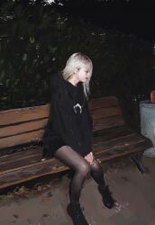 1girl bench black_hoodie black_shoes can drink_can fuyumurasaki highres hood hoodie lips looking_to_the_side outdoors plant real_life realistic shoes sitting soda_can solo trash_can
