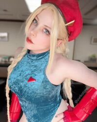 1girl bare_shoulders blonde_hair braid breasts cammy_white cammy_white_(cosplay) cosplay cosplay_photo fingerless_gloves gloves green_eyes hand_on_own_hip hat highres large_breasts leotard looking_at_viewer photo_(medium) real_life sleeveless street_fighter yuriko_tiger