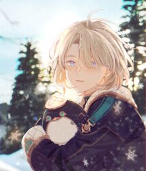 1boy absurdres black_jacket blonde_hair blue_eyes blurry blurry_background breath commentary day freckles freminet_(genshin_impact) genshin_impact hair_between_eyes highres holding jacket long_sleeves male_focus outdoors parted_lips pers_(genshin_impact) pers_thepenguin snow snowflakes tree upper_body