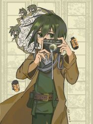 1girl artist_name belt black_hair brown_belt brown_coat camera coat green_jacket green_pants highres holding holding_camera jacket kino_(kino_no_tabi) kino_no_tabi open_clothes open_coat pants short_hair solo yuitelephone