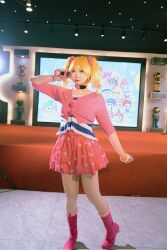 Rule 34 | blonde hair, boots, bracelet, cosplay, cosplay photo, digimon, digimon xros wars, digimon xros wars: toki wo kakeru shounen hunter-tachi, hair ornament, hairpin, highres, jewelry, lipstick, long hair, looking at viewer, makeup, nochino, orange eyes, photo (medium), pig, pink eyes, real life, striped clothes, suzaki airu, twintails