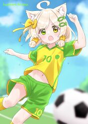 1boy ahoge animal_ears ball blurry blurry_background blurry_foreground cat_boy cat_ears cat_tail depth_of_field fish_hair_ornament green_eyes green_shorts hair_ornament hair_tubes hazakura_hinata heterochromia highres kaya_(hazakura_hinata) looking_at_viewer male_focus navel open_mouth original outdoors shirt short_hair short_shorts short_sleeves shorts soccer_ball soccer_uniform solo sportswear t-shirt tail trap yellow_eyes