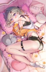 1girl absurdres arm_tattoo ass black_camisole black_choker black_shorts blush bow camisole cat choker commentary_request copyright_notice facial_mark full_body geshumaro grey_hair hair_bow head_on_pillow heart heart-shaped_pillow highres hood hooded_jacket indoors jacket komori_met looking_at_viewer lying official_art on_bed on_side orange_jacket pillow ribbon_choker sample_watermark short_shorts shorts single_off_shoulder single_sock socks soles solo strap_slip tattoo thigh_strap triangle triangle_facial_mark virtual_youtuber vspo! watermark white_socks