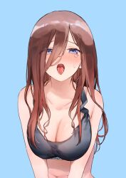 1girl black_sports_bra blue_background blush breasts brown_hair clothes_writing collarbone commentary crying crying_with_eyes_open go-toubun_no_hanayome hair_between_eyes highres large_breasts long_hair looking_at_viewer memidesuyo nakano_miku open_mouth purple_eyes simple_background solo sports_bra tears tongue tongue_out upper_body
