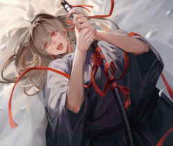 1girl :d brown_hair commentary_request hair_between_eyes hakama hands_up holding holding_sword holding_weapon ingenkita japanese_clothes katana long_hair looking_at_viewer lying on_back on_bed open_mouth original red_eyes red_ribbon ribbon sheath sheathed smile solo sword teeth tongue upper_body upper_teeth_only weapon white_petals