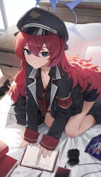 1girl absurdres all_fours armband black_coat black_hat black_shorts blue_archive blue_eyes book breasts cleavage coat halo hat highres huhi_(huhi_1211) indoors iroha_(blue_archive) long_hair looking_at_viewer medium_breasts messy_hair necktie on_bed open_collar peaked_cap red_armband red_hair red_necktie shorts snack socks solo unworn_socks very_long_hair