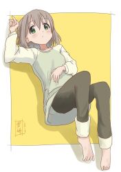 1girl 2019 barefoot black_pants blush dated green_eyes grey_hair hand_on_own_stomach highres kohshibasaki long_shirt looking_at_viewer lying multicolored_shirt no_shoes on_ground pants short_hair signature solo yama_no_susume yellow_background yukimura_aoi