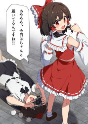 2girls black_hair black_skirt blush bow camera commentary_request detached_sleeves female_pervert hair_bow hakurei_reimu hat highres holding holding_camera implied_pantyshot lying medium_hair multiple_girls necono_(nekonosora1207) on_ground pervert red_bow red_eyes red_shirt red_skirt shameimaru_aya shirt skirt sleeveless sleeveless_shirt tokin_hat touhou translated white_shirt wide_sleeves