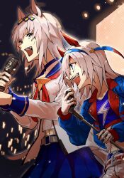 2girls ahoge animal_ears belt blue_eyes blue_jacket blue_shirt blue_skirt breasts choker concert crop_top fingerless_gloves gloves grey_hair hair_ornament headband highres holding holding_microphone_stand horse_ears jacket karate_(karatedazey) long_hair long_sleeves microphone microphone_stand midriff multiple_girls music oguri_cap_(umamusume) open_clothes open_jacket open_mouth pants screen shirt singing skirt small_breasts smile tamamo_cross_(umamusume) umamusume upper_body white_gloves white_jacket white_pants