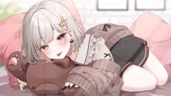 1girl black_skirt blush brown_cardigan cardigan cushion earrings grey_shirt hair_ornament heterochromia highres indie_virtual_youtuber indoors jewelry long_sleeves looking_at_viewer lying medium_hair red_eyes shirt skirt smile solo stuffed_animal stuffed_toy tarou_(komekueyo) teddy_bear thighs tongue tongue_out yellow_eyes yuzuki_yuki_(vtuber)