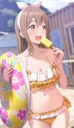 1girl :o bikini bow bow_bikini breasts brown_hair closed_mouth collarbone floral_print food frilled_bikini frills hairband halterneck highres holding holding_swim_ring innertube kunikida_hanamaru long_hair looking_to_the_side love_live! love_live!_sunshine!! medium_breasts multicolored_bikini navel open_mouth outdoors popsicle shamakho swim_ring swimsuit two-tone_bikini upper_body white_hairband yellow_bow