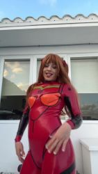 Rule 34 | 1girl, animated, ass, blue sky, bodysuit, breasts, brown eyes, cosplay, dancing, day, female focus, long hair, looking at viewer, looking back, medium breasts, neon genesis evangelion, orange hair, photo (medium), real life, red bodysuit, rosalia (singer), sky, smile, solo, sound, souryuu asuka langley, souryuu asuka langley (cosplay), spanish (nationality), standing, teeth, video