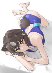 1girl animal_ear_fluff animal_ears ass bare_arms bare_legs bare_shoulders barefoot bear_ears bear_girl bear_tail black_hair brown_bear_(kemono_friends) brown_eyes commentary competition_swimsuit extra_ears feet full_body hair_between_eyes highres kemono_friends looking_at_viewer lying on_stomach one-piece_swimsuit short_hair solo swimsuit tail tanabe_(fueisei) toes