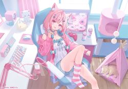 1girl animal_ear_fluff animal_ears cat cat_ears cat_girl fukahire_(ruinon) hair_ornament headphones headphones_around_neck heart heart_hair_ornament indie_virtual_youtuber indoors jacket long_hair long_sleeves on_chair open_mouth pink_hair pink_jacket ribbon shorts sitting smile socks solo striped_clothes striped_socks virtual_youtuber wing_hair_ornament yuuki_sakuna