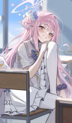 1girl absurdres blue_archive blue_bow blue_bowtie blush bow bowtie capelet chair classroom commentary desk dress feathered_wings hair_bun hair_intakes halo highres indoors knee_up long_hair mika_(blue_archive) on_chair p1n pantyhose pink_eyes pink_hair school_chair school_desk scrunchie single_side_bun sitting smile solo very_long_hair white_capelet white_dress white_pantyhose white_wings wings wrist_scrunchie