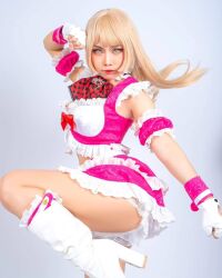 Rule 34 | 1girl, ass, bare shoulders, blonde hair, boots, breasts, cosplay, cosplay photo, crop top, emilie de rochefort, emilie de rochefort (cosplay), fingerless gloves, gloves, grey background, high heels, highres, long hair, looking at viewer, panties, photo (medium), real life, skirt, sleeveless, standing, standing on one leg, tekken, tekken tag tournament 2, thighs, underwear, y.yorenji, yellow eyes