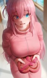 1girl absurdres blue_eyes blurry blurry_background blush bocchi_the_rock! box breasts commentary cowboy_shot cube_hair_ornament english_commentary fingernails gift gotoh_hitori hair_between_eyes hair_ornament heart-shaped_box highres holding holding_gift indoors jacket large_breasts light_particles long_hair long_sleeves looking_at_viewer numanoan pants parted_lips pink_hair pink_jacket pink_pants pink_ribbon ribbon school solo valentine very_long_hair zipper