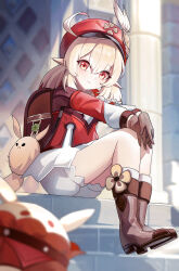 1girl absurdres ahoge backpack bag blonde_hair bloomers boots brown_boots brown_gloves brown_hair full_body genshin_impact gloves hat highres klee_(genshin_impact) knee_boots long_sleeves looking_at_viewer medium_hair outdoors pointy_ears red_eyes red_hat short_twintails sitting sitting_on_stairs smile socks solo stairs twintails underwear white_bloomers white_socks wuzhihuijia