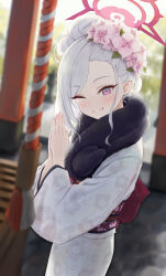 1girl absurdres blue_archive blurry blurry_background blush commentary_request depth_of_field dixo_(user_srff3835) floral_print floral_print_kimono flower fur_scarf hair_bun hair_flower hair_ornament halo highres japanese_clothes kimono long_hair long_sleeves looking_at_viewer mutsuki_(blue_archive) mutsuki_(new_year)_(blue_archive) obi official_alternate_costume one_eye_closed own_hands_together palms_together pink_flower print_kimono purple_eyes sash smile solo teeth white_hair white_kimono wide_sleeves