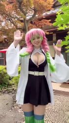 1girl alina_becker animated audible_music breasts brown_eyes cleavage cosplay dancing demon_slayer_uniform female_focus green_hair happy kanroji_mitsuri kanroji_mitsuri_(cosplay) kimetsu_no_yaiba large_breasts long_hair multicolored_hair photo_(medium) pink_hair real_life smile solo sound teeth video