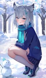 1girl absurdres animal_ear_fluff animal_ears aqua_eyes aqua_halo aqua_scarf blue_archive blue_skirt blue_sweater blush closed_mouth commentary_request cross cross_hair_ornament day forest from_side grey_hair hair_between_eyes hair_ornament halo highres inverted_cross kneehighs licking_lips long_bangs long_hair long_sleeves looking_at_viewer looking_to_the_side miniskirt nature outdoors plaid_clothes plaid_skirt pleated_skirt scarf school_uniform shiroko_(blue_archive) shuvi_(shuvi1125) simple_background skirt snow snowman socks squatting sweater tongue tongue_out turning_head white_socks winter winter_uniform