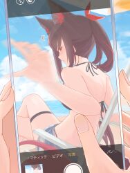 1girl ^^^ absurdres animal_ear_fluff animal_ears bikini black_bikini black_hair bow cellphone cellphone_photo chamomile_(kazumasa) cloud cloudy_sky commentary_request crossed_legs earrings fox_ears fox_girl fox_tail hair_between_eyes hair_bow highres holding holding_phone hololive jewelry kurokami_fubuki long_hair looking_at_viewer looking_back multicolored_hair outdoors phone ponytail red_bow red_eyes red_hair sidelocks sitting sky smartphone streaked_hair swimsuit tail taking_picture thigh_strap virtual_youtuber