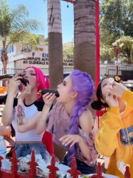 Rule 34 | 3girls, arm tattoo, black hair, bottle, bracelet, braid, building, cosplay, earrings, eating, eyeshadow, foil, food, food in mouth, jewelry, korean (nationality), kpop demon hunters, long hair, makeup, makizushi, mira (kpop demon hunters), multiple girls, outdoors, photo (medium), pig tail, pine tree, pink hair, plate, purple hair, real life, ring, rumi (kpop demon hunters), sushi, table, tail, tattoo, tree, water bottle, zoey (kpop demon hunters)