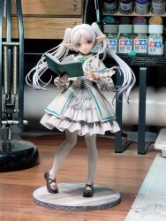 Rule 34 | 1girl, alternate costume, art tools in frame, book, bow, bowtie, brown shoes, capelet, center frills, choker, closed mouth, collared capelet, commentary request, corset, dress, elf, expressionless, figure (medium), figure stage, frieren, frilled capelet, frilled sleeves, frills, full body, garage kit (medium), green bow, green bowtie, green choker, green eyes, hands up, heel up, highres, holding, holding book, layered dress, lolita fashion, long hair, long sleeves, looking to the side, mary janes, open book, pantyhose, parted bangs, photo (medium), pointy ears, puffy long sleeves, puffy sleeves, shanyuya, shoes, sleeve cuffs, solo, sousou no frieren, standing, table, thick eyebrows, twintails, unconventional media, very long hair, white capelet, white corset, white dress, white hair, white pantyhose, wooden table
