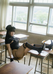 1girl black_hair black_one-piece_swimsuit breasts chair curtains desk from_side gloves hat highres indoors japanese_(nationality) large_breasts looking_at_viewer medium_hair one-piece_swimsuit photo_(medium) police_hat real_life school school_chair school_desk shinonome_umi sitting swimsuit window