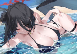 1girl beach bikini black_bikini black_hair black_wings blue_archive breasts cleavage closed_mouth day hair_bun halo hasumi_(blue_archive) hasumi_(swimsuit)_(blue_archive) highres huge_breasts kurotsuki_machi long_hair lying on_side outdoors red_eyes red_halo single_side_bun smile solo swimsuit thigh_strap water wings